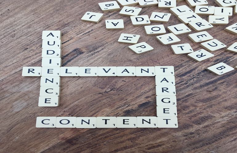 Image: content, audience, relevant, target spelled out in Scrabble tiles